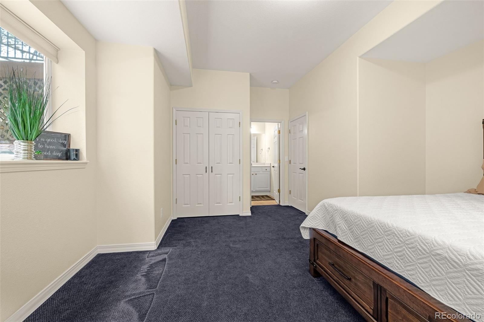 25 Leaming Road Colorado Springs, CO 80906 - Photo 34 of 48 a room with a bed and a window