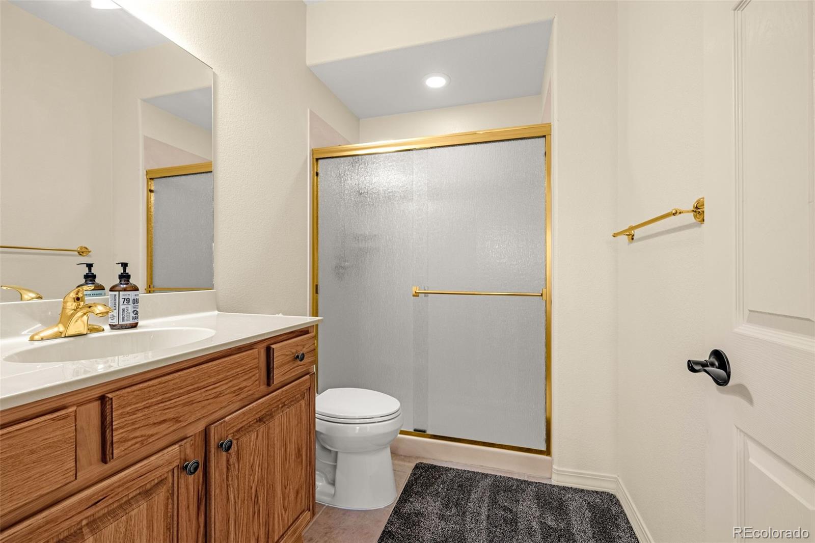 25 Leaming Road Colorado Springs, CO 80906 - Photo 35 of 48 a bathroom with a sink toilet and shower