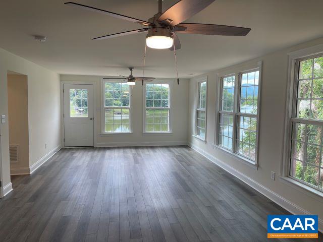 791 Westwood Road Stanardsville, VA 22973 - Photo 12 of 24 a view of an empty room with wooden floor and a window