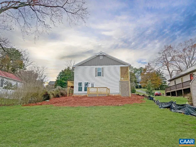 a house view with a sitting space and garden
