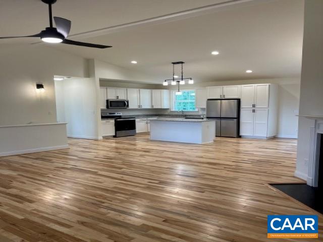 791 Westwood Road Stanardsville, VA 22973 - Photo 5 of 24 a view of large kitchen with kitchen island stainless steel appliances refrigerator stove microwave and cabinets
