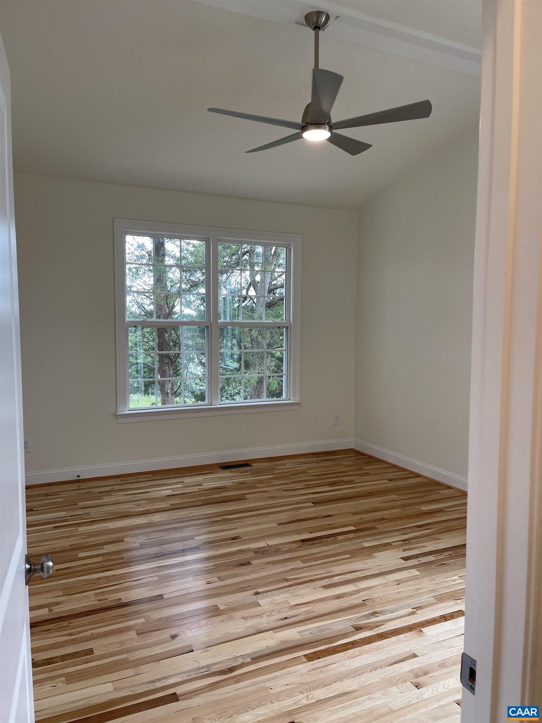 791 Westwood Road Stanardsville, VA 22973 - Photo 10 of 24 a view of an empty room with wooden floor and a window