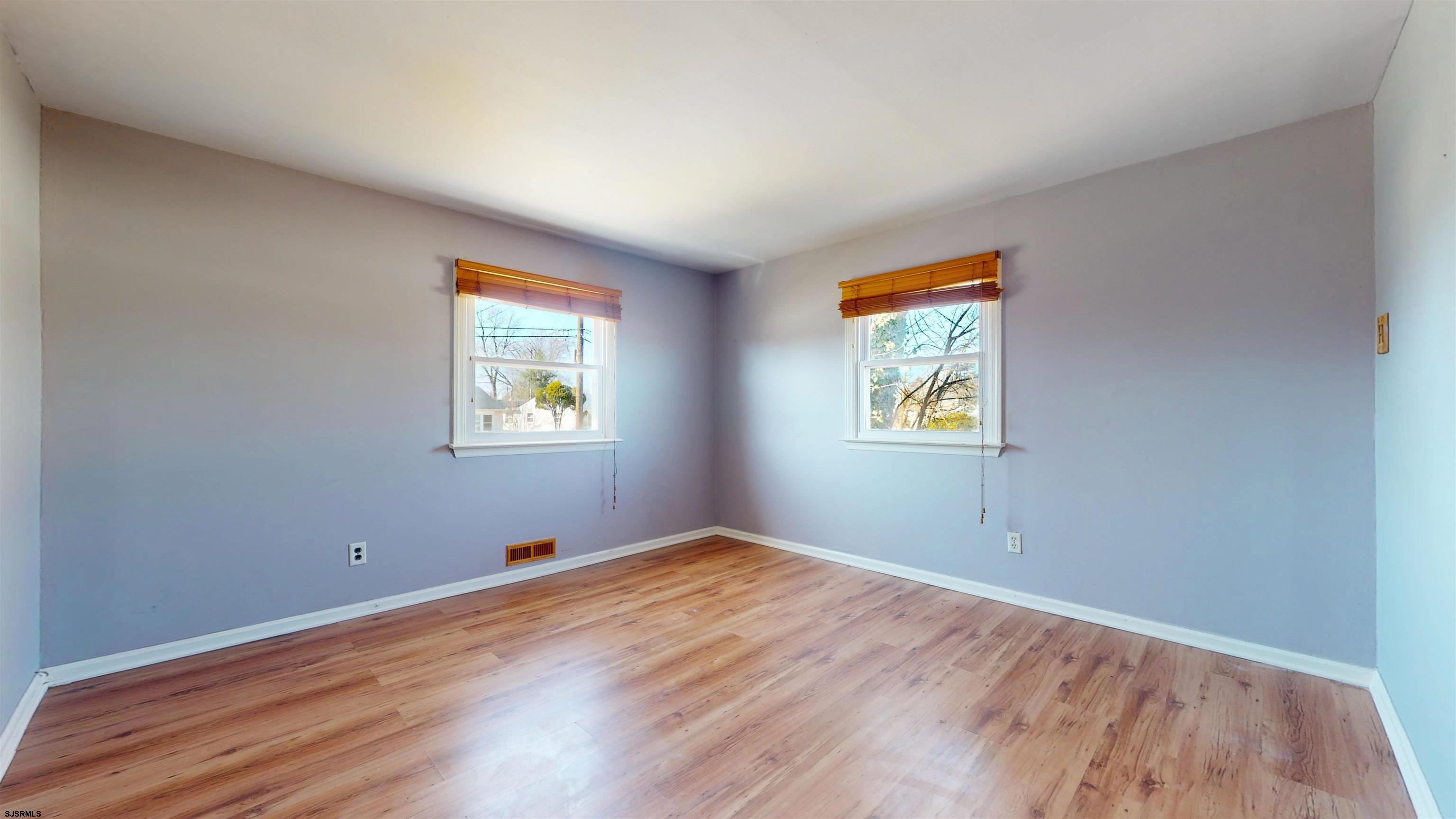 123 Devon Road Somers Point, NJ 08244 - Photo 14 of 41 a view of room with window and wooden floor