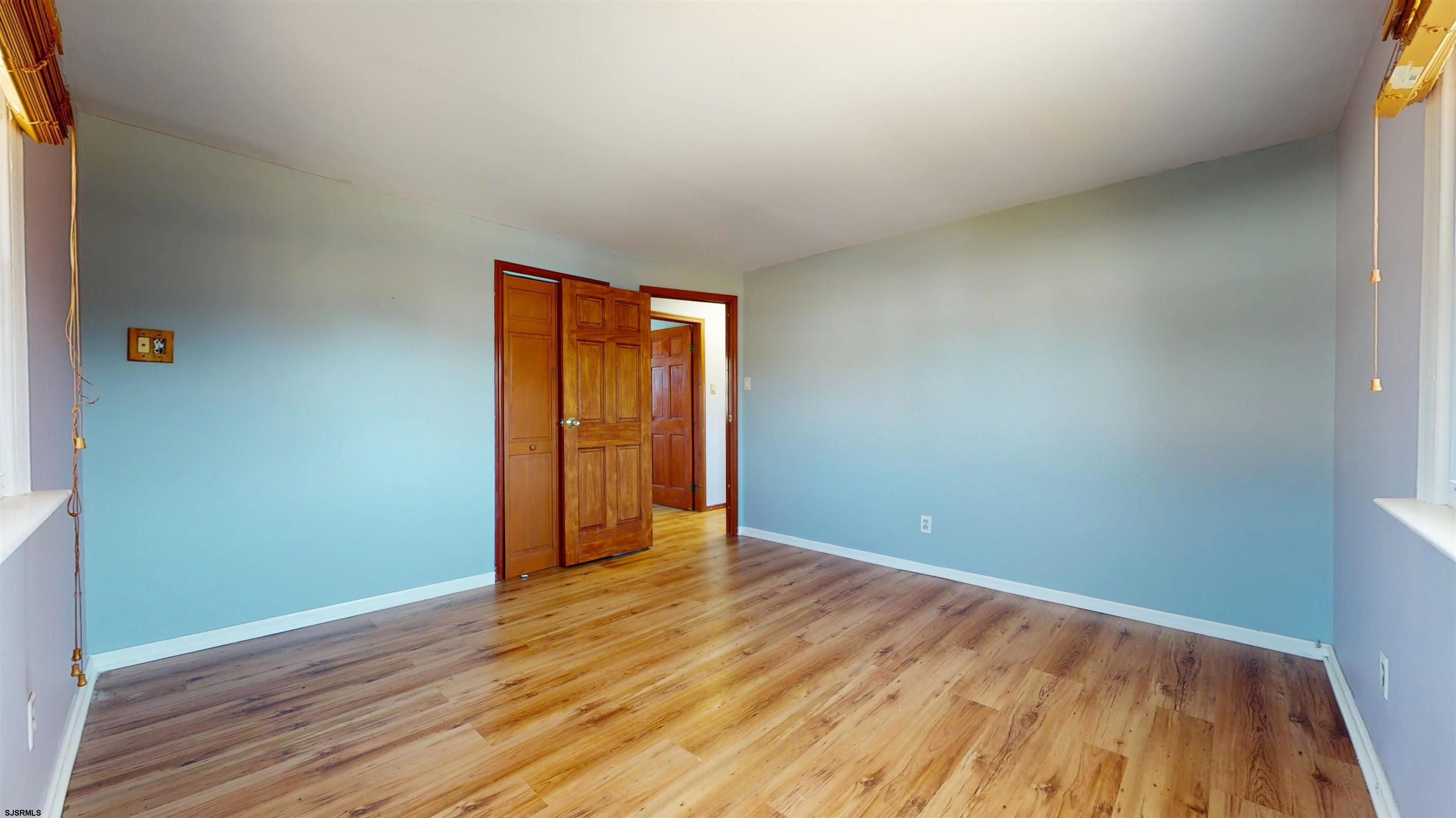 123 Devon Road Somers Point, NJ 08244 - Photo 16 of 41 an empty room with wooden floor and closet