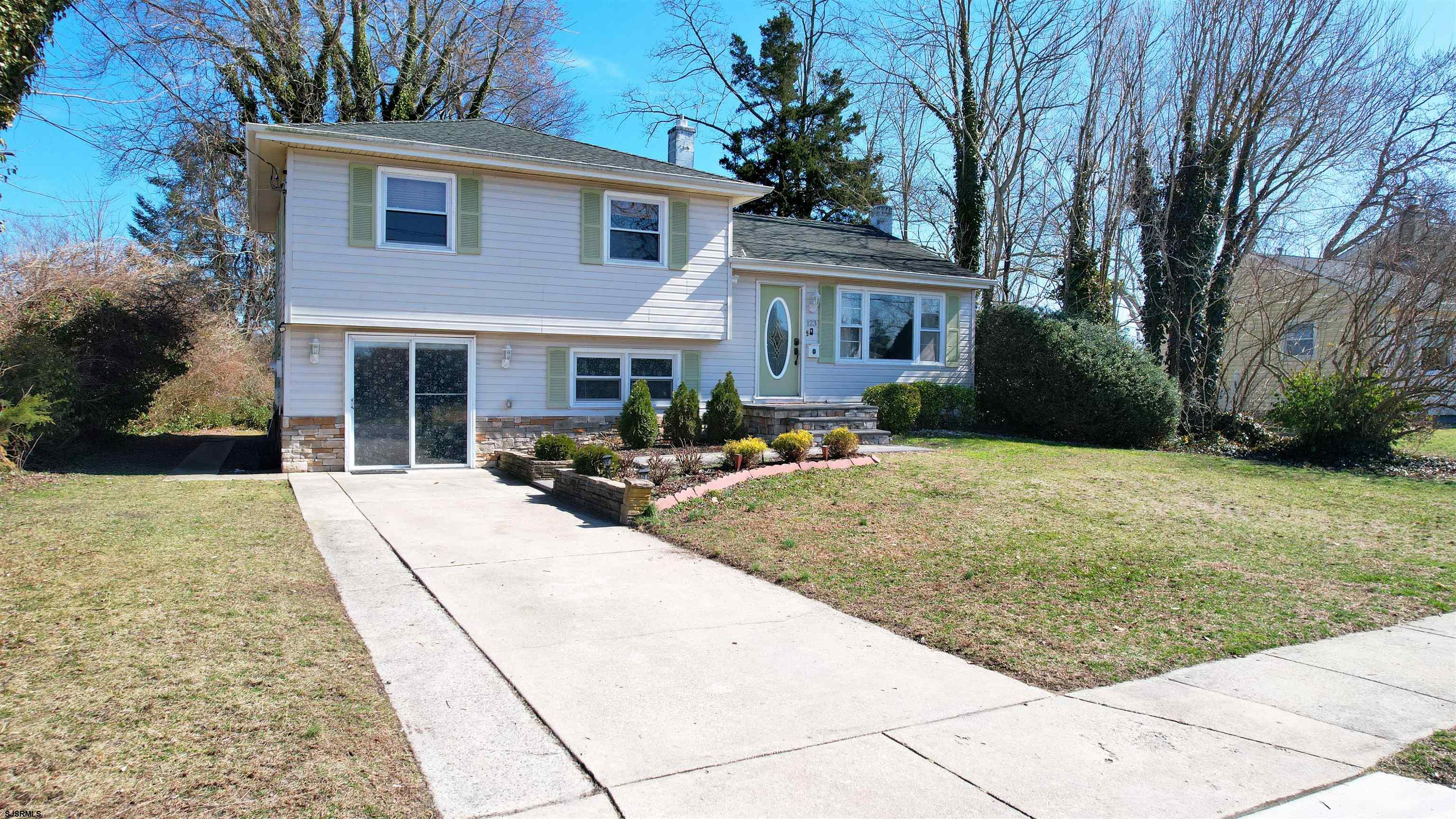 123 Devon Road Somers Point, NJ 08244 - Photo 2 of 41 a front view of a house with garden