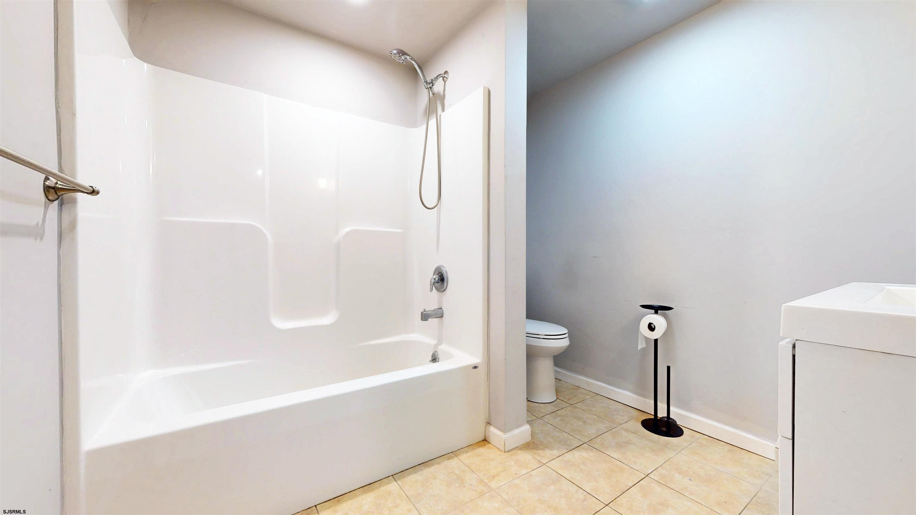 123 Devon Road Somers Point, NJ 08244 - Photo 26 of 41 a bathroom with a bathtub and a shower