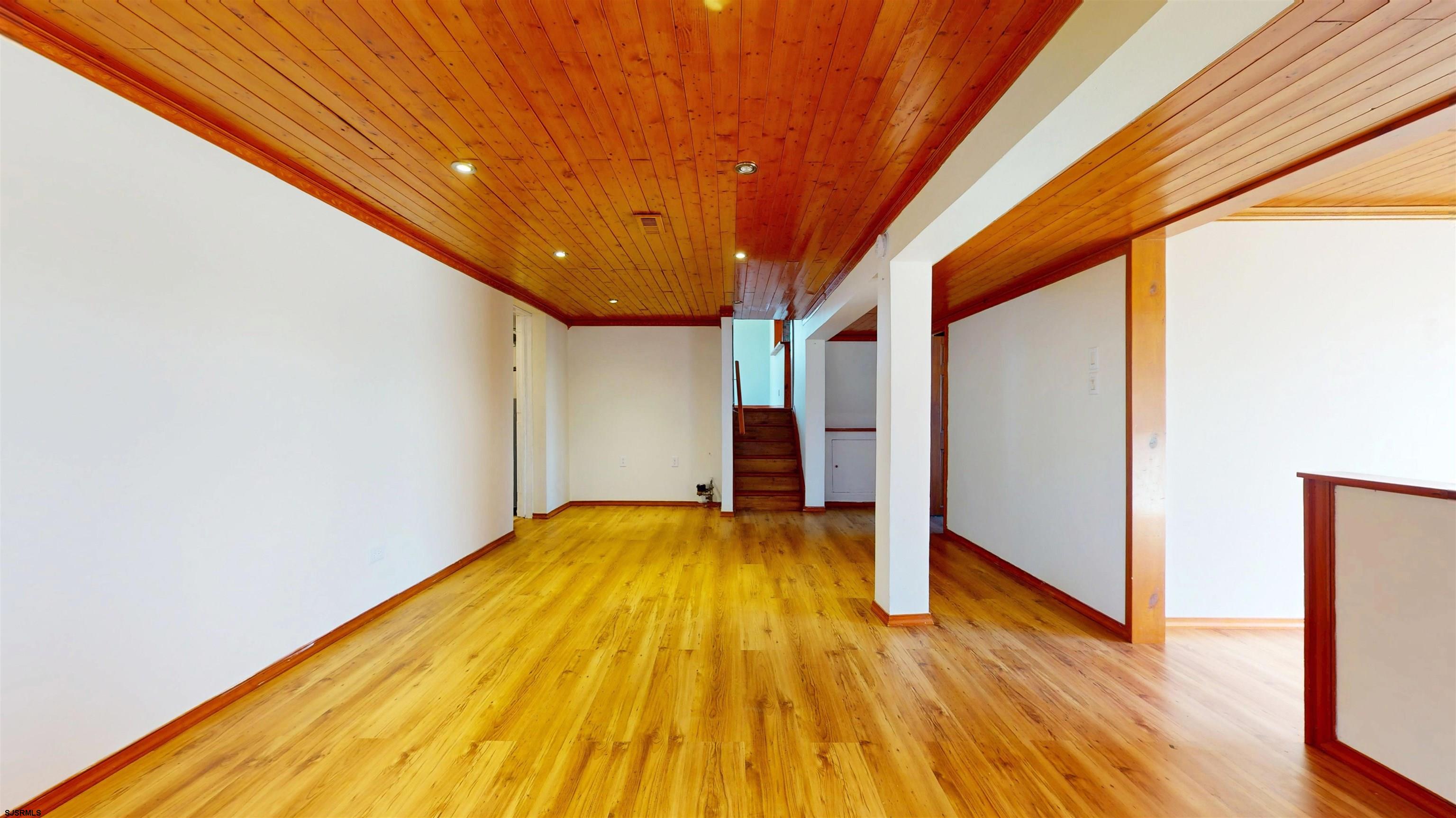 123 Devon Road Somers Point, NJ 08244 - Photo 30 of 41 a view of a big room with wooden floor
