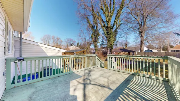 a view of a balcony with wooden floor