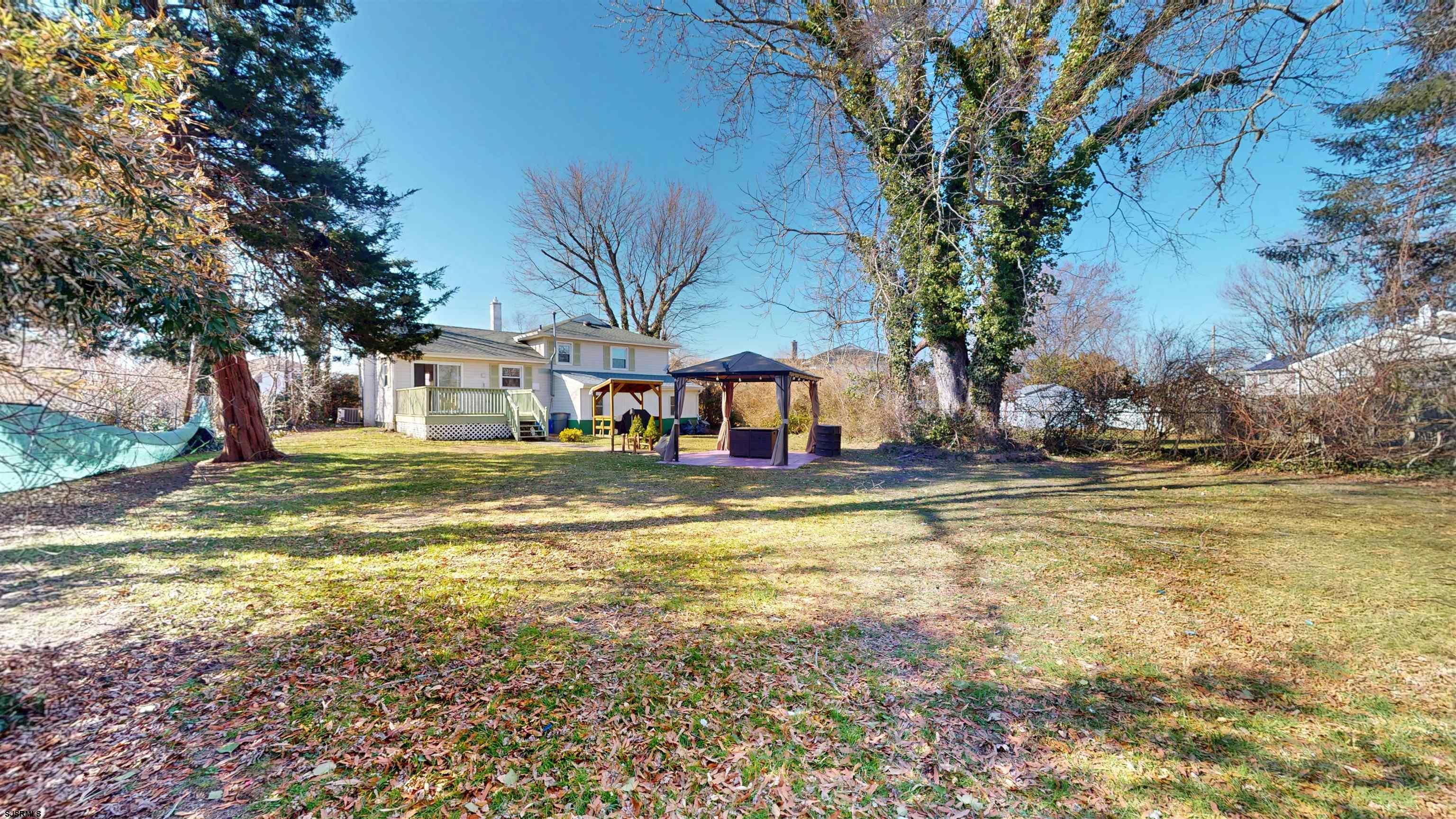 123 Devon Road Somers Point, NJ 08244 - Photo 37 of 41 a view of a swimming pool with a house