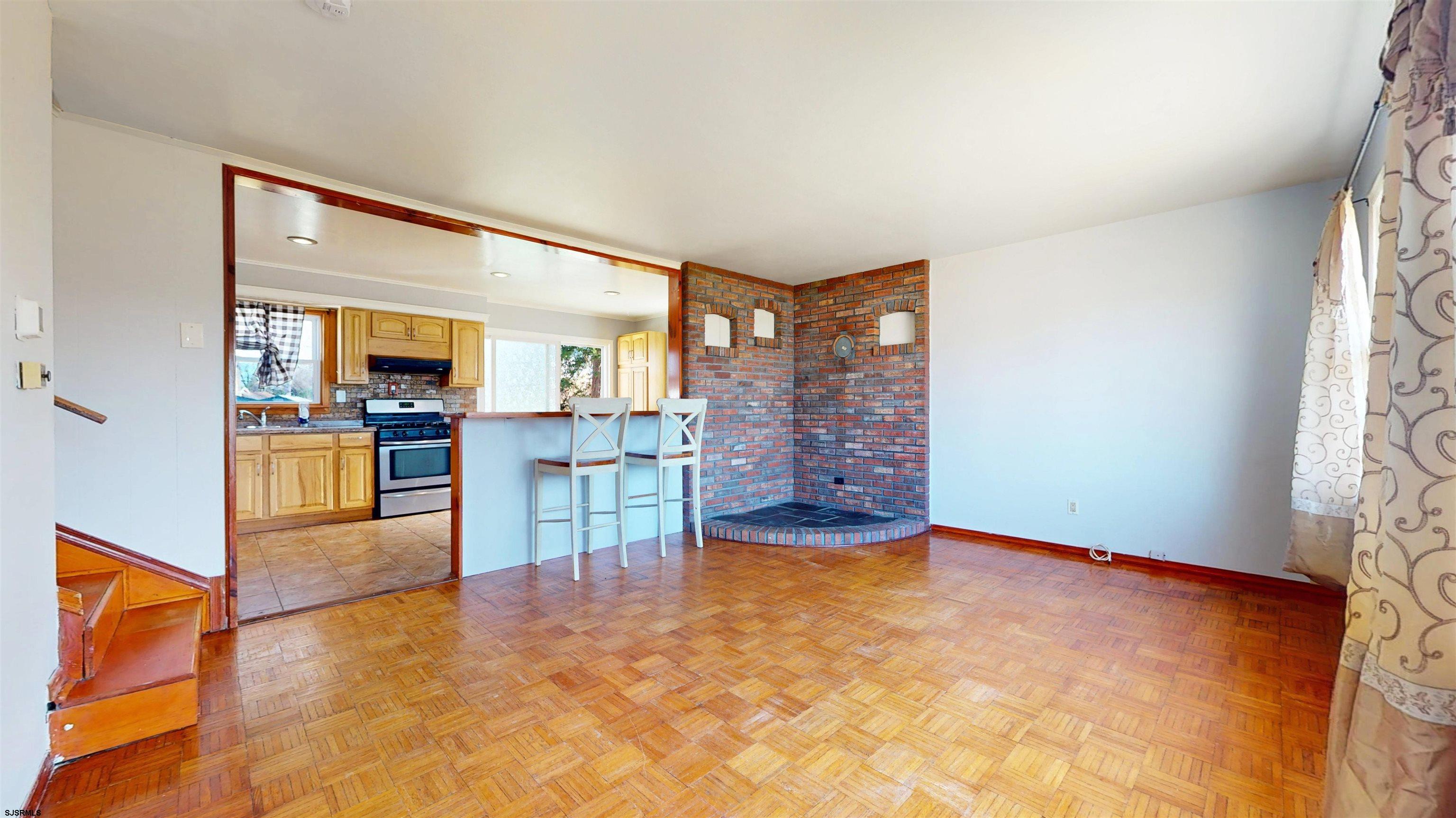 123 Devon Road Somers Point, NJ 08244 - Photo 7 of 41 a view of a livingroom with furniture and a kitchen