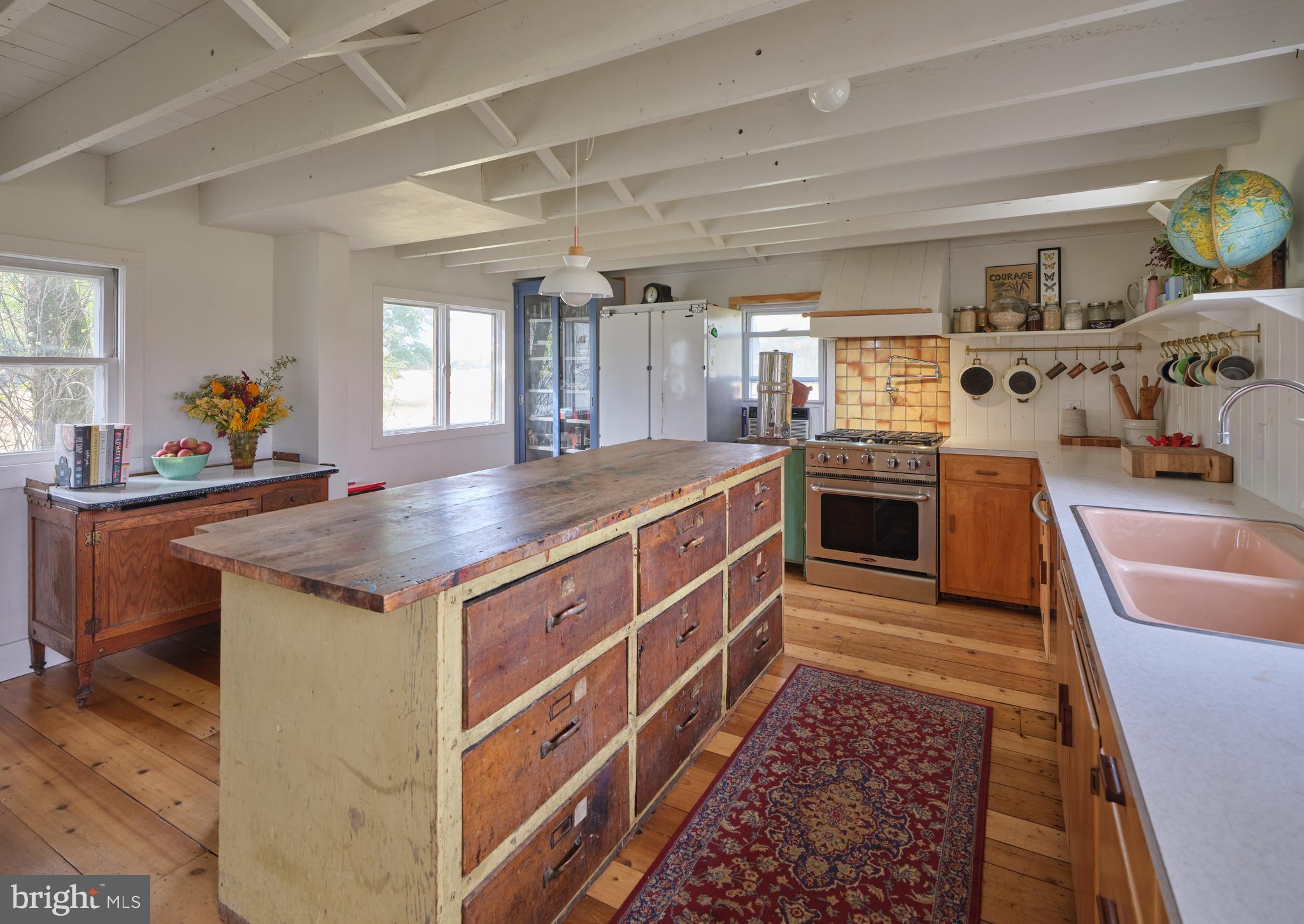 641 Cafferty Road Ottsville, PA 18942 - Photo 27 of 45 a kitchen with stainless steel appliances granite countertop a sink stove and cabinets