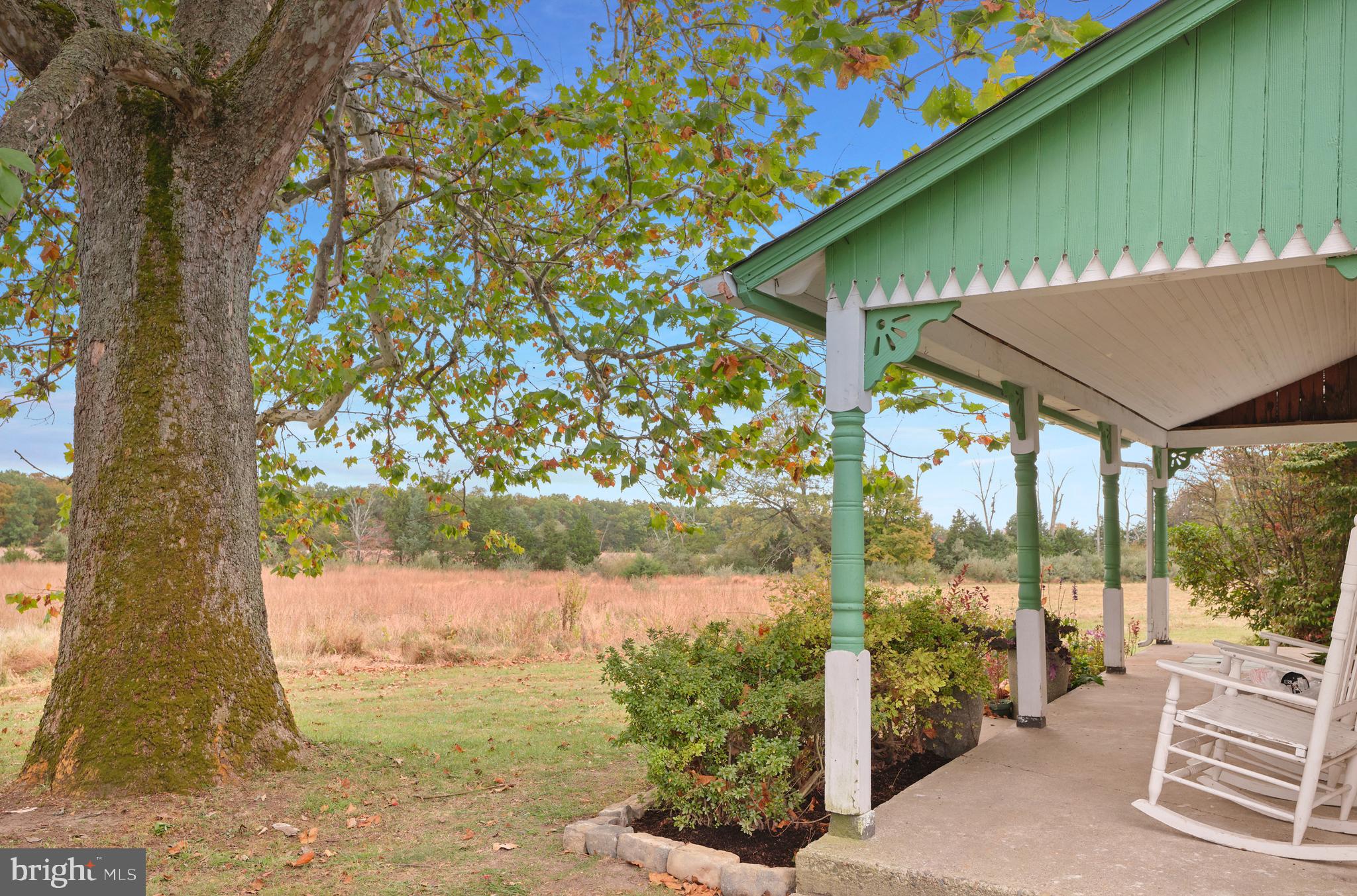 641 Cafferty Road Ottsville, PA 18942 - Photo 3 of 45 a view of a patio with table and chairs under an umbrella
