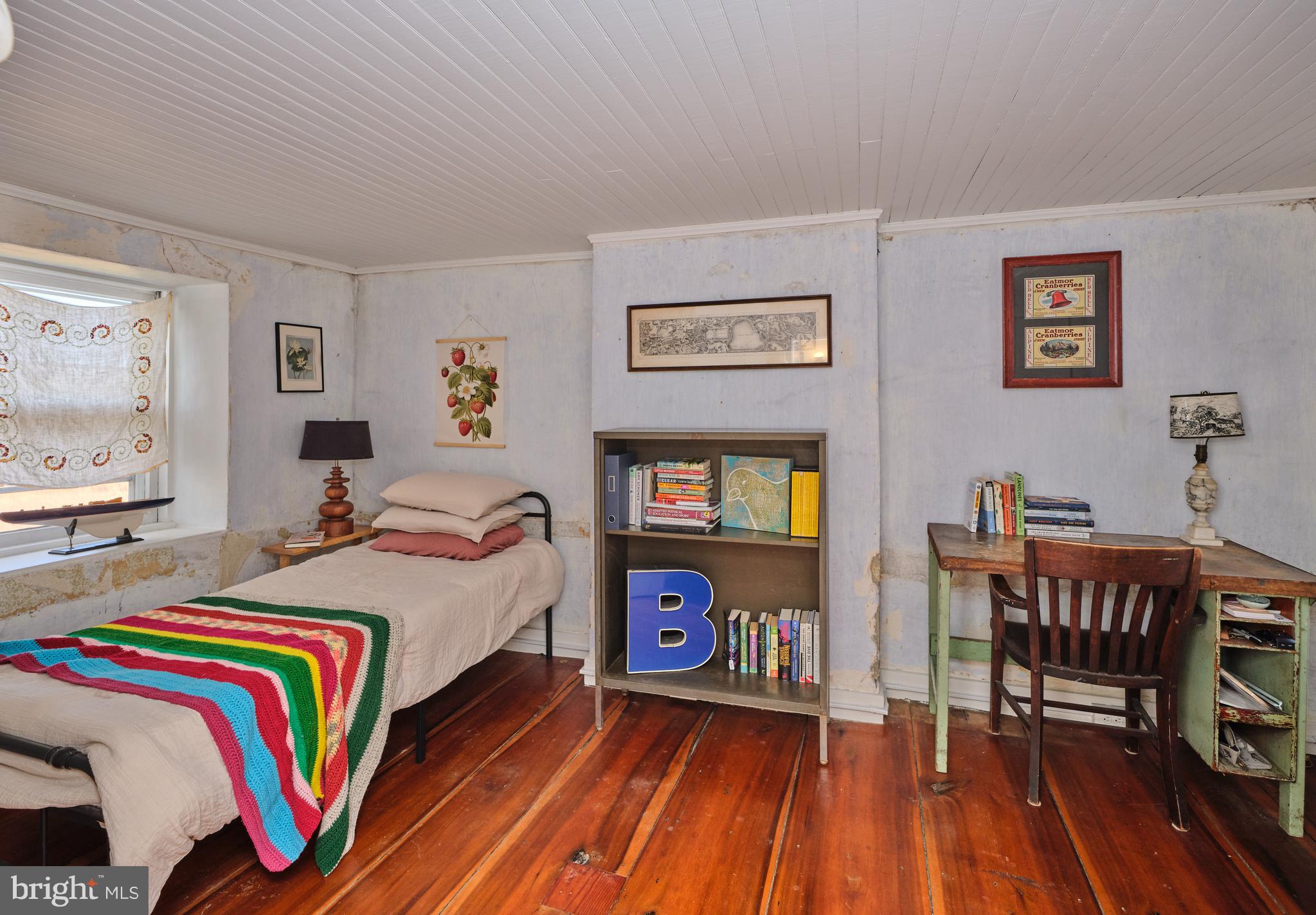 641 Cafferty Road Ottsville, PA 18942 - Photo 42 of 45 a bedroom with a bed and wooden floor