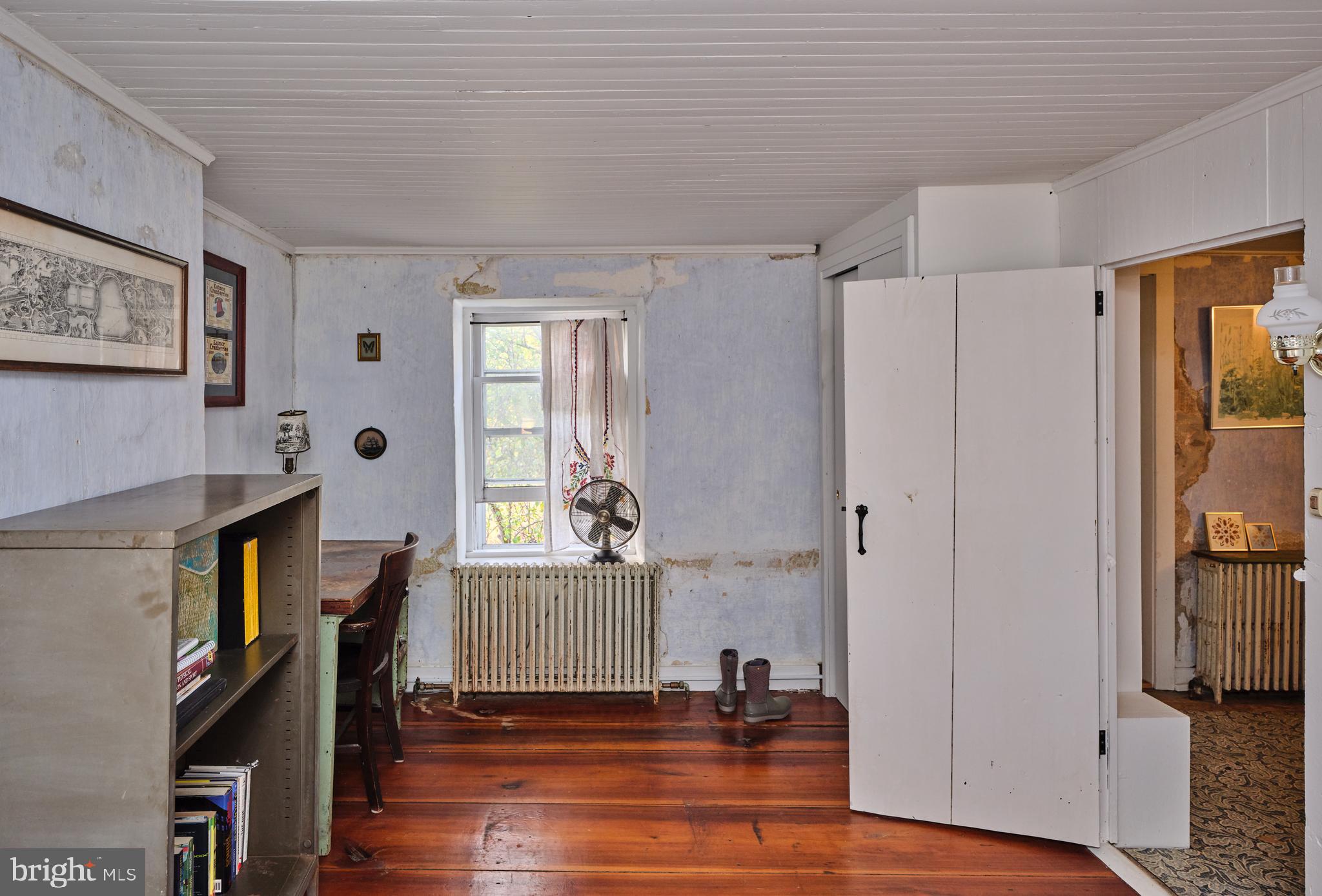 641 Cafferty Road Ottsville, PA 18942 - Photo 43 of 45 a view of empty room with wooden floor and fan