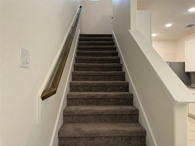 a view of a air conditioner and window in a room