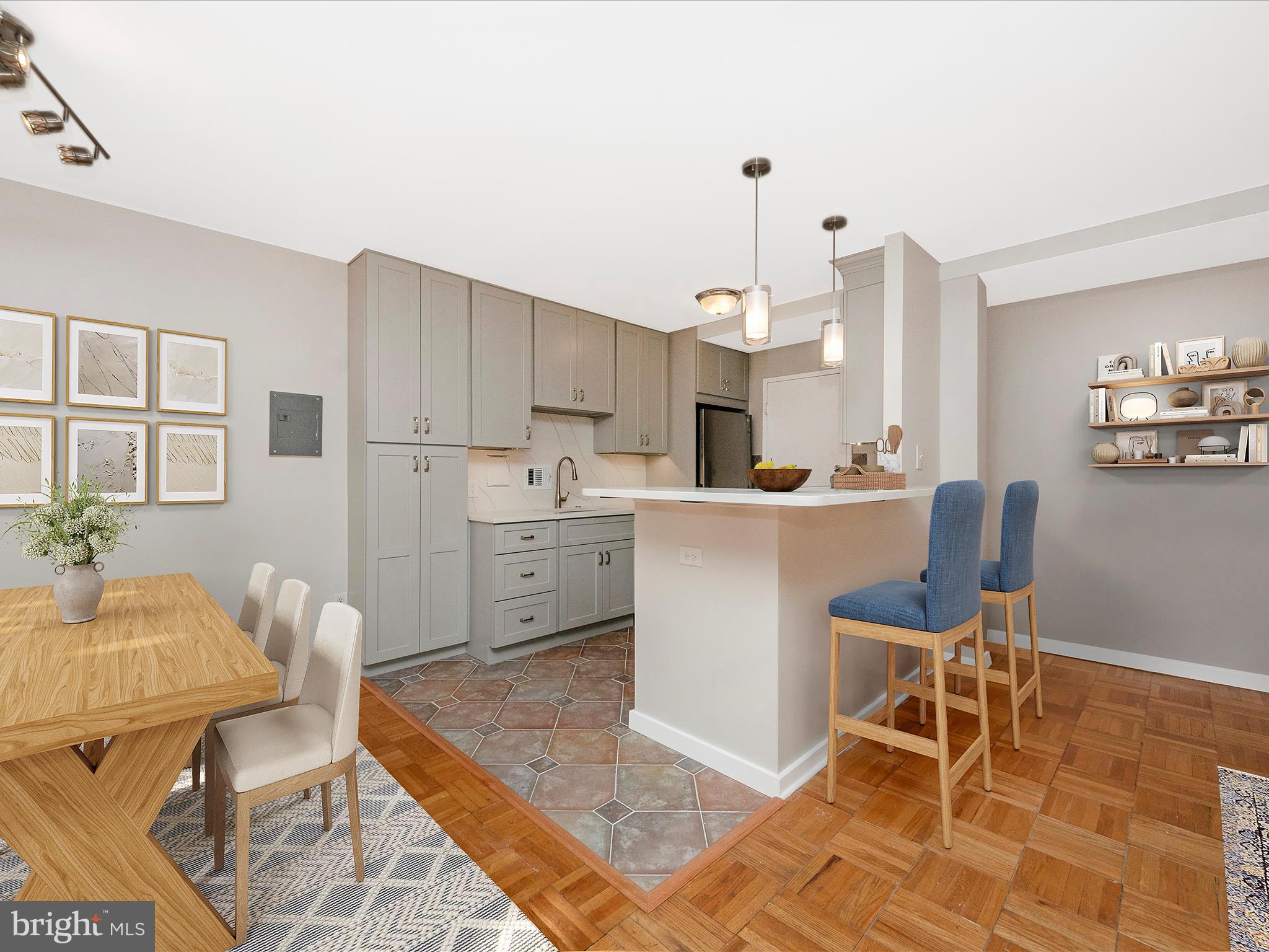 a living room with stainless steel appliances kitchen island granite countertop furniture and a rug