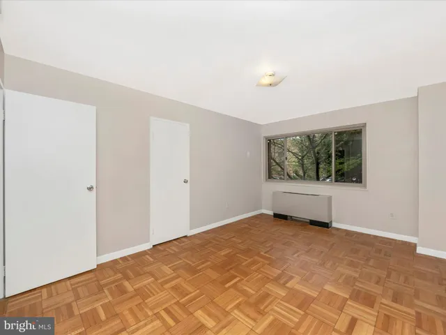 a view of an empty room with a window