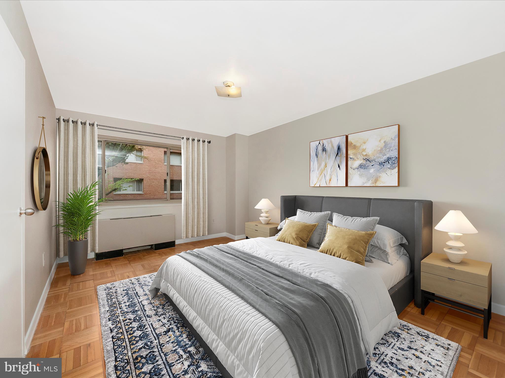3900 Tunlaw Road Northwest, Unit 104 Washington, DC 20007 - Photo 16 of 36 a bedroom with a bed a couch and a window