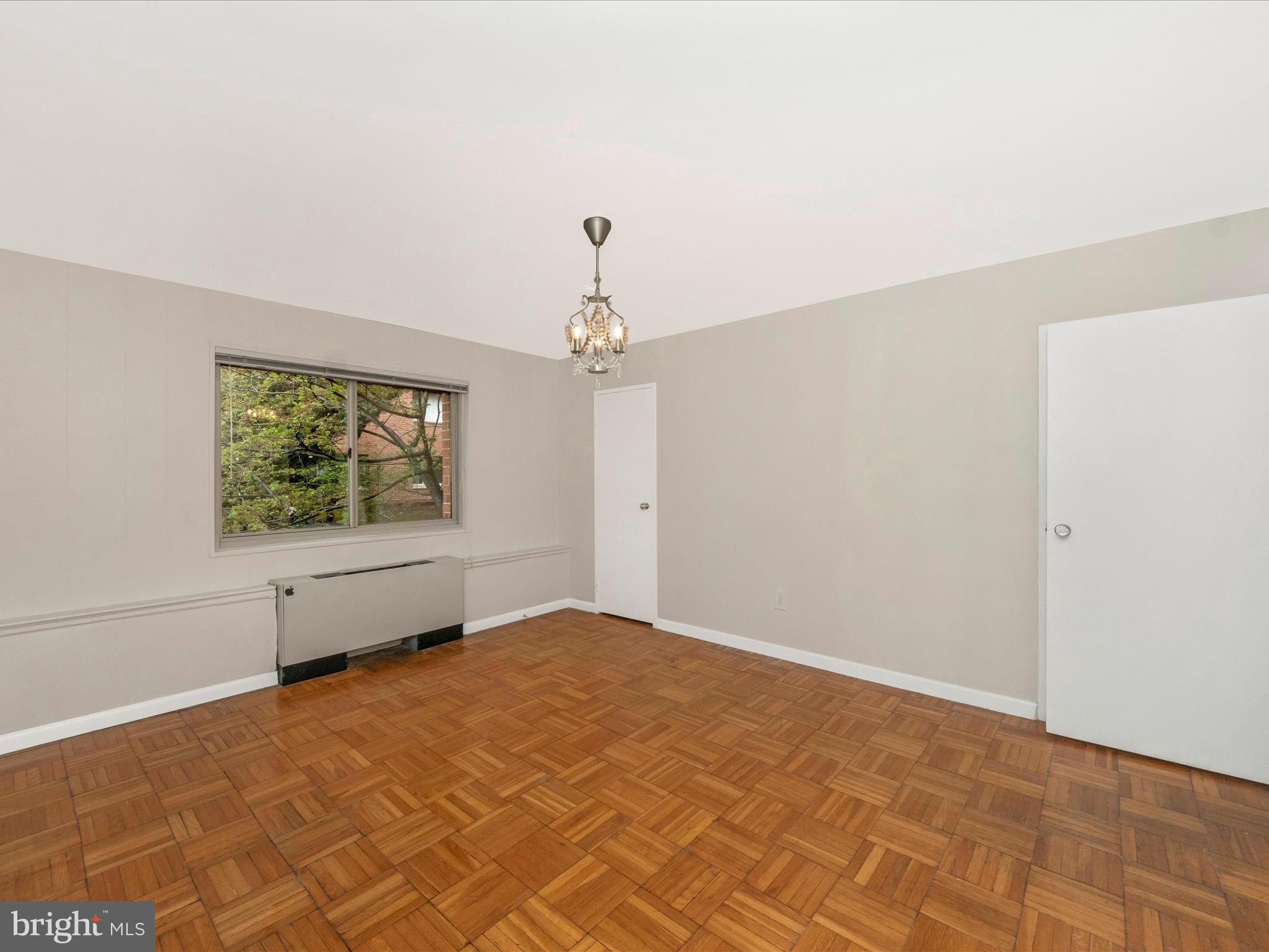3900 Tunlaw Road Northwest, Unit 104 Washington, DC 20007 - Photo 17 of 36 a view of an empty room with a window