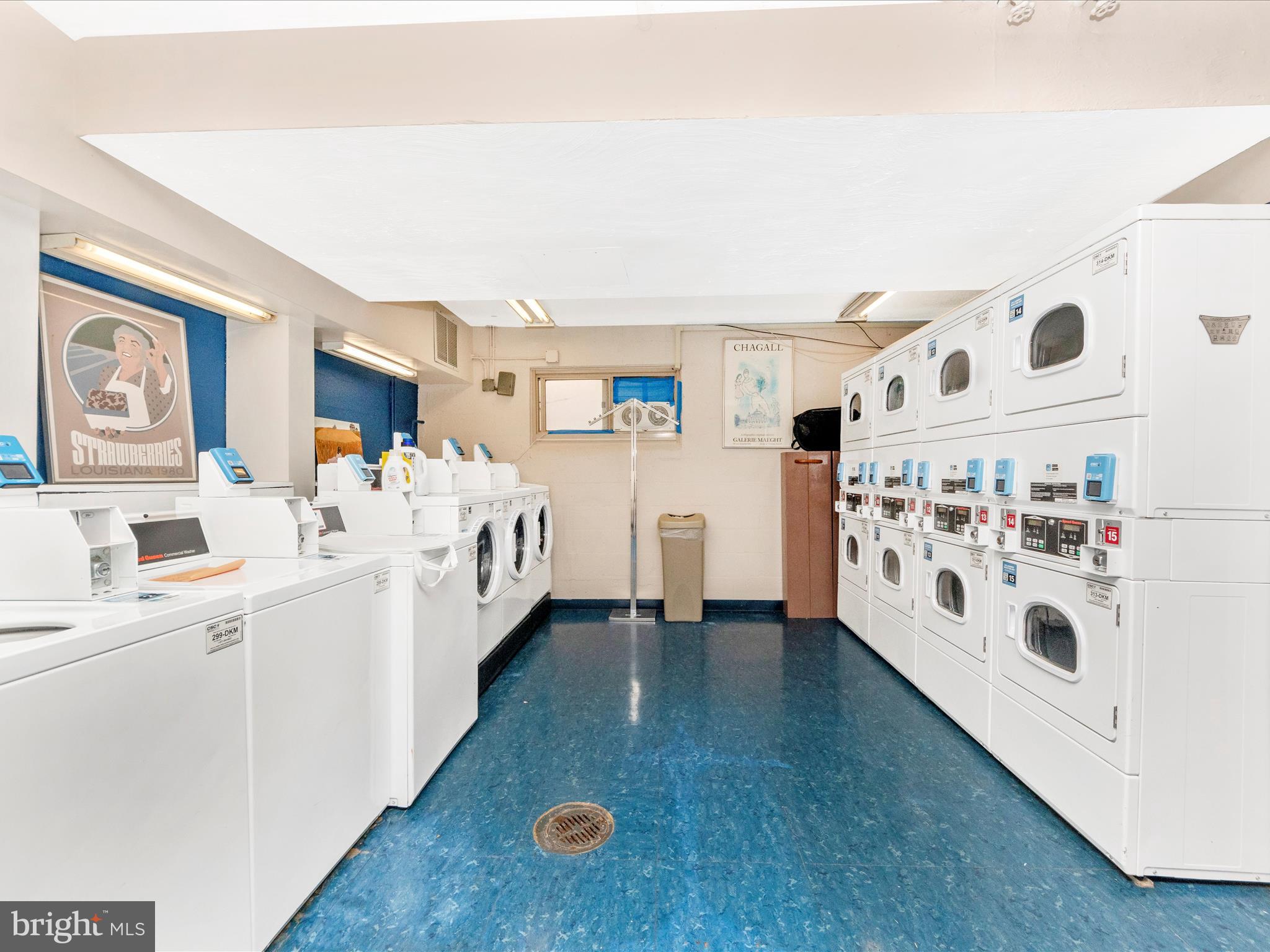 3900 Tunlaw Road Northwest, Unit 104 Washington, DC 20007 - Photo 23 of 36 a large white bed sitting in a kitchen next to a window