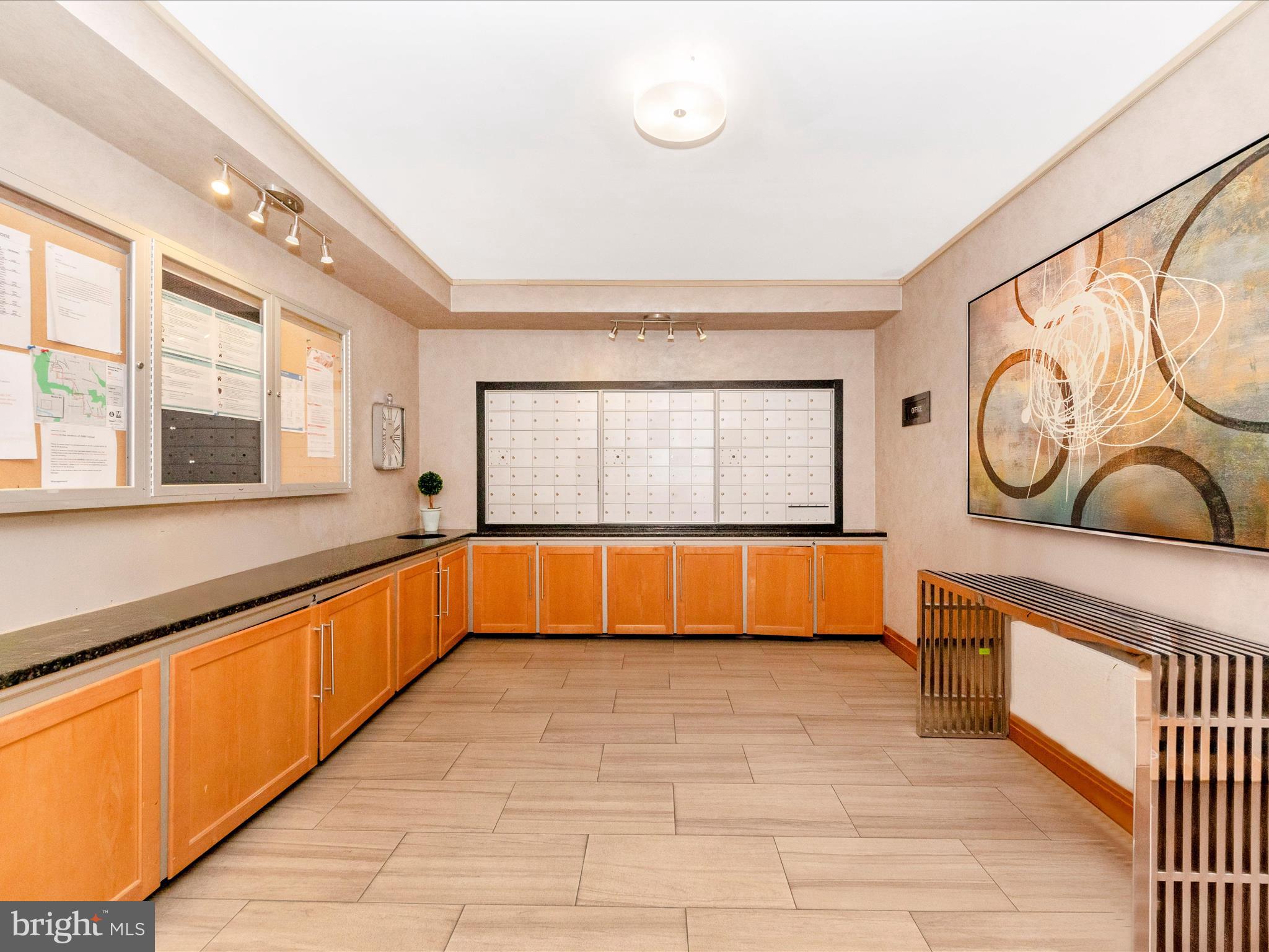 3900 Tunlaw Road Northwest, Unit 104 Washington, DC 20007 - Photo 24 of 36 a large white kitchen with a large window