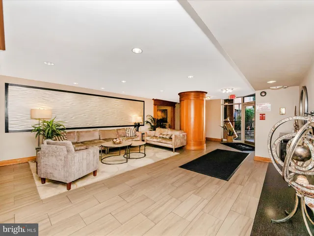 a view of a livingroom with furniture and a rug