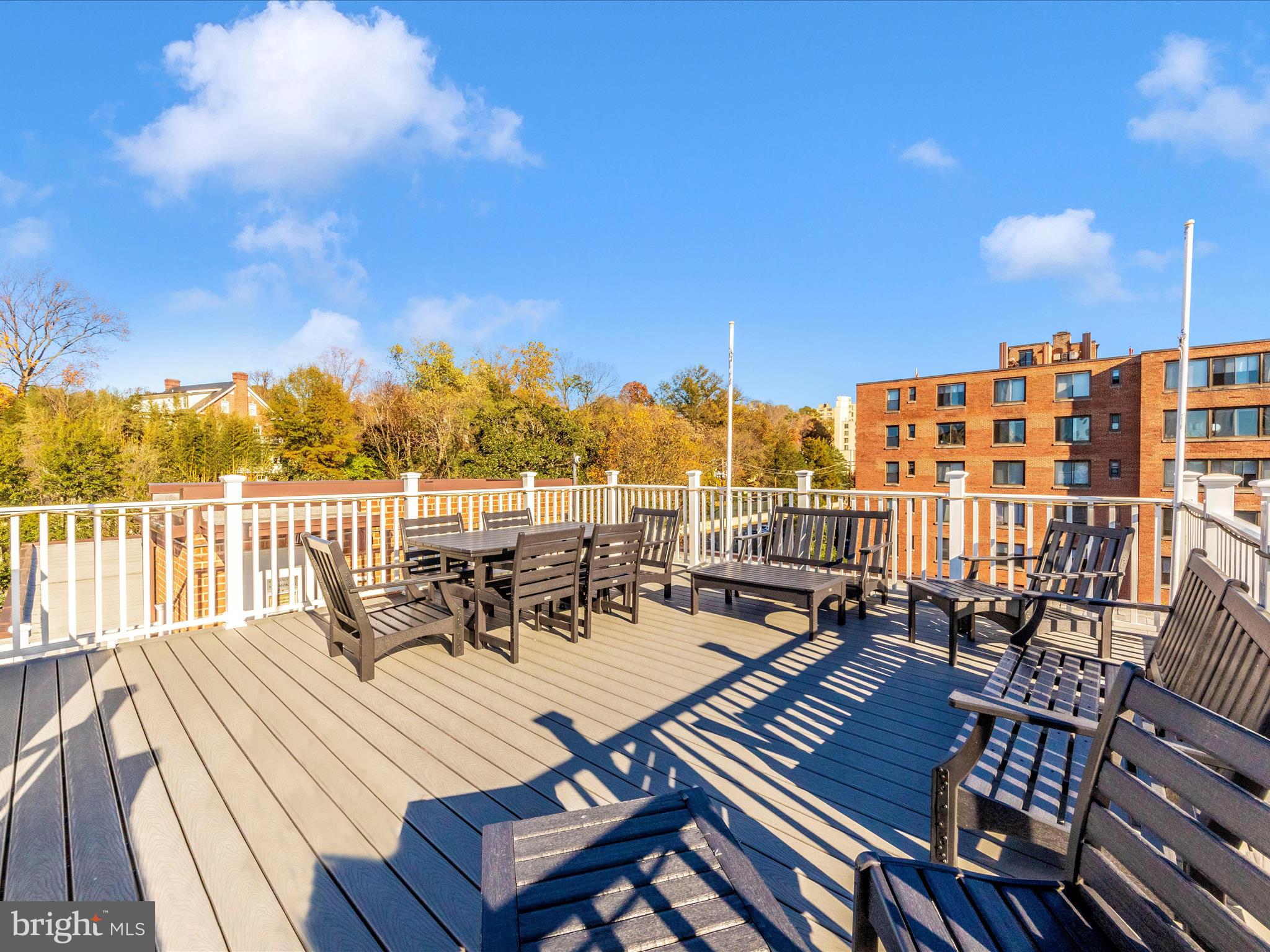3900 Tunlaw Road Northwest, Unit 104 Washington, DC 20007 - Photo 29 of 36 a view of a roof deck with seating area
