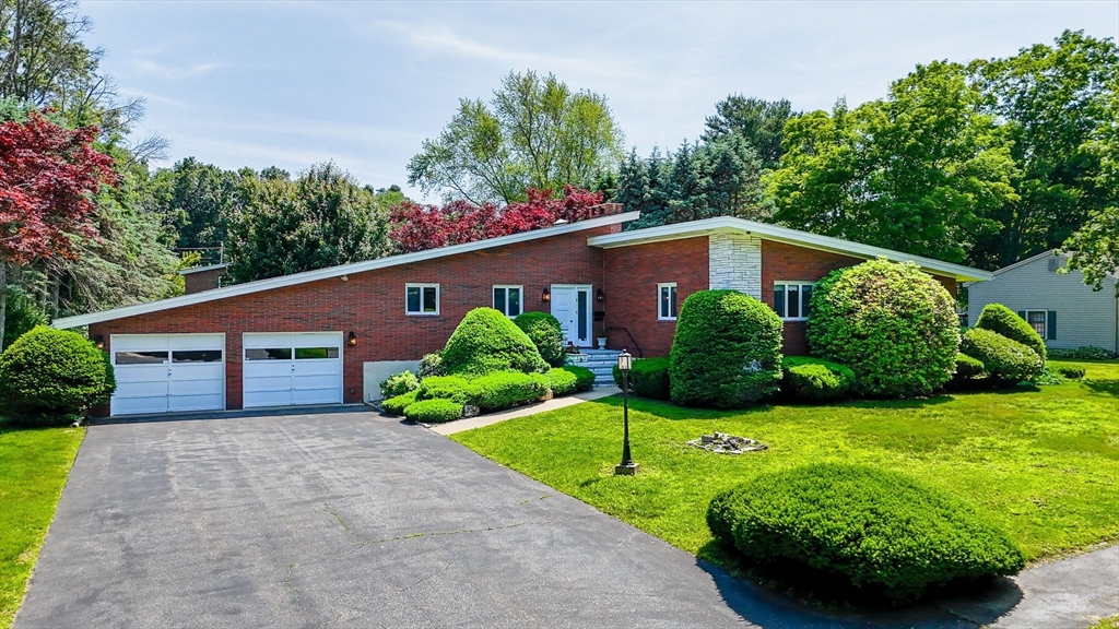 9 Seneca Drive Danvers, MA 01923 - Photo 2 of 41 a house view with a garden space