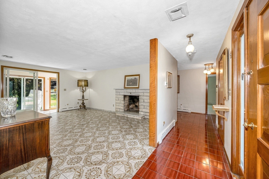 9 Seneca Drive Danvers, MA 01923 - Photo 7 of 41 a view of a hallway with wooden floor and staircase