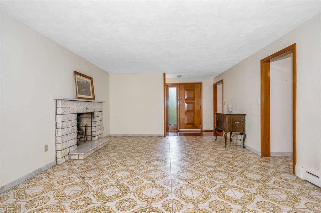 9 Seneca Drive Danvers, MA 01923 - Photo 10 of 41 a view of livingroom with furniture and a fireplace