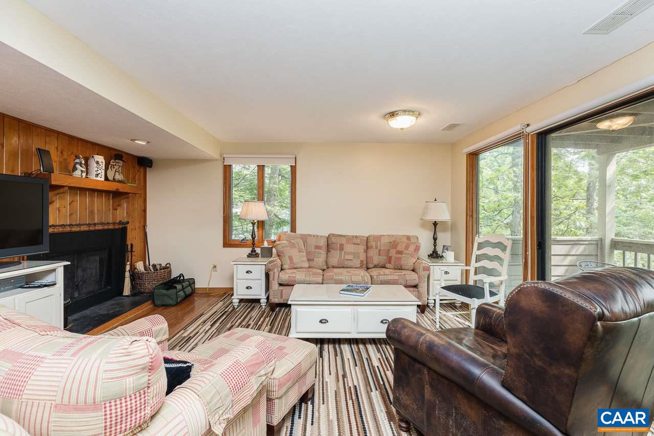 402 3 Ridges Roseland, VA 22967 - Photo 1 of 15 a living room with furniture large windows and a flat screen tv