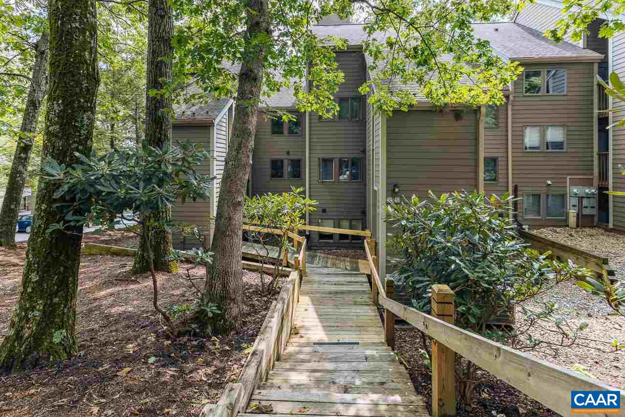402 3 Ridges Roseland, VA 22967 - Photo 15 of 15 a porch with seating space and trees in the background