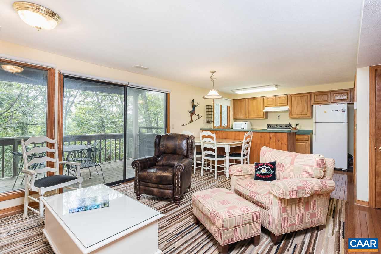402 3 Ridges Roseland, VA 22967 - Photo 2 of 15 a living room with furniture large windows and wooden floor