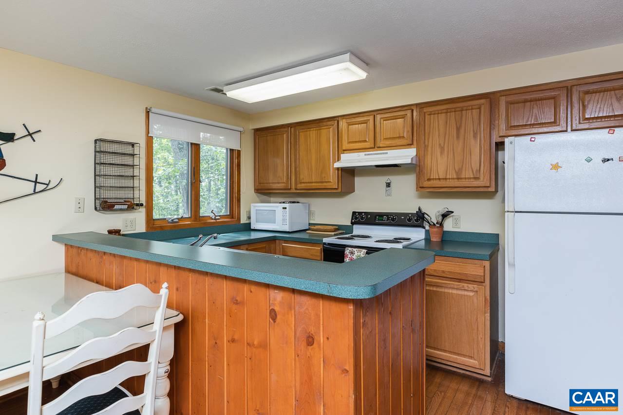 402 3 Ridges Roseland, VA 22967 - Photo 5 of 15 a kitchen with stainless steel appliances granite countertop a sink stove and refrigerator