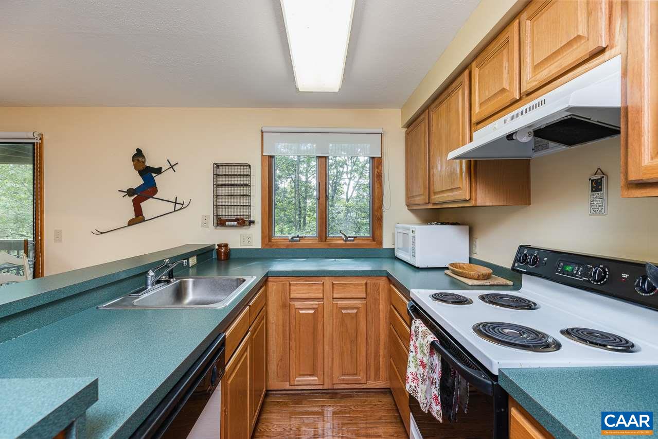 402 3 Ridges Roseland, VA 22967 - Photo 6 of 15 a kitchen that has a sink a stove and a window