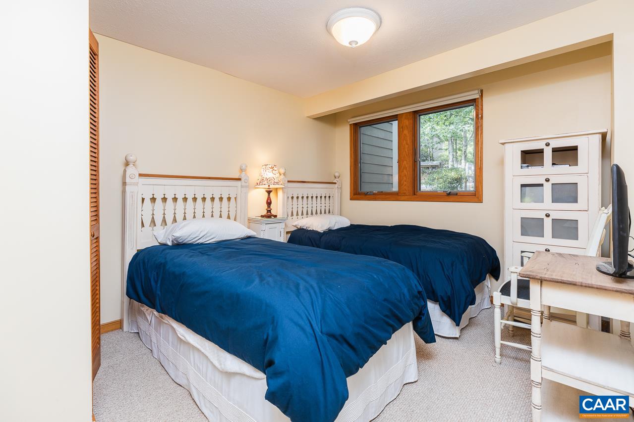 402 3 Ridges Roseland, VA 22967 - Photo 8 of 15 a bedroom with a bed and a window