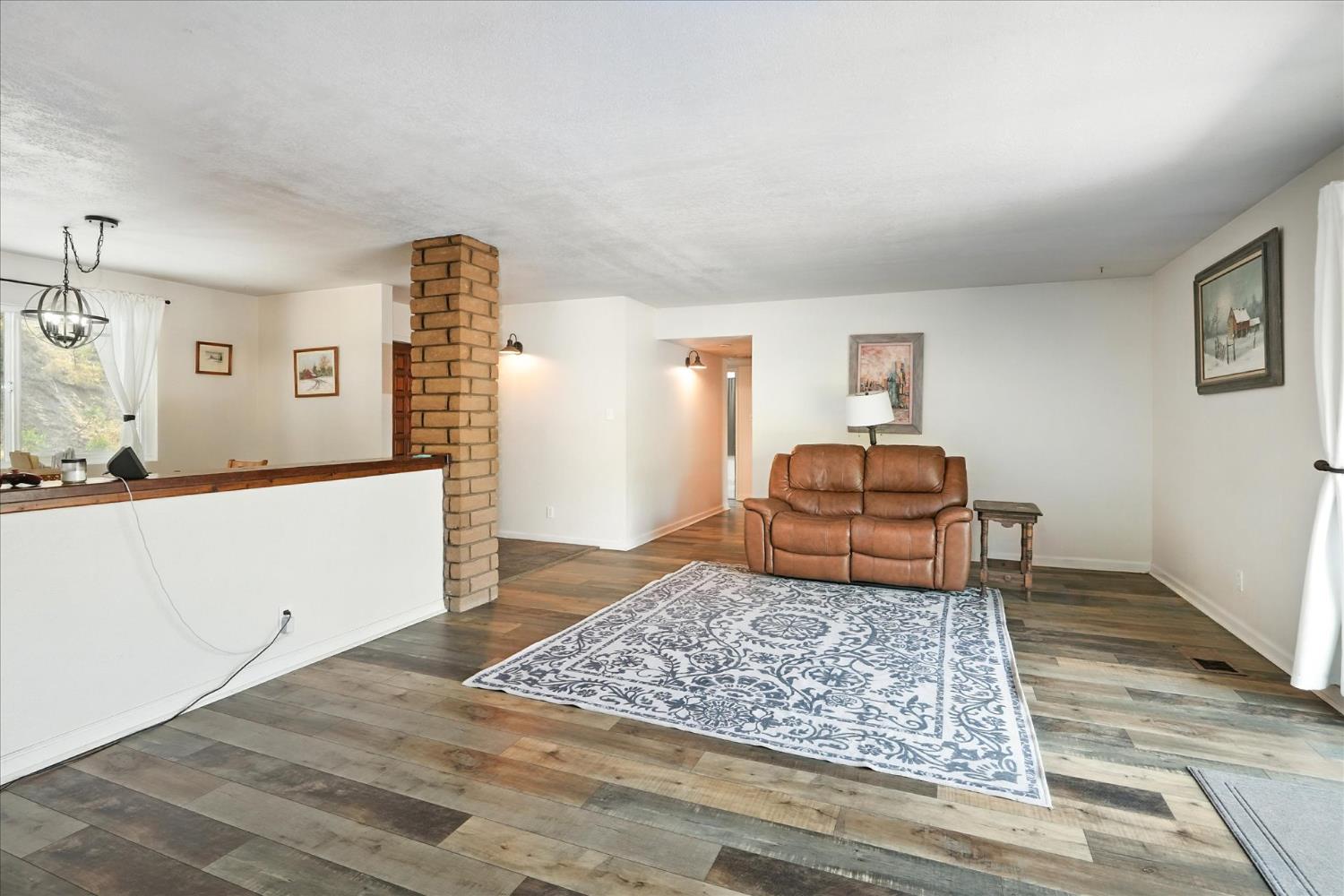 39712 Deer Ridge Drive Oakhurst, CA 93644 - Photo 12 of 40 a living room with couch and a rug