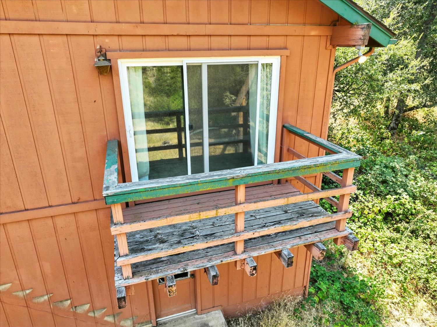 39712 Deer Ridge Drive Oakhurst, CA 93644 - Photo 29 of 40 a view of a house with a small yard and wooden fence