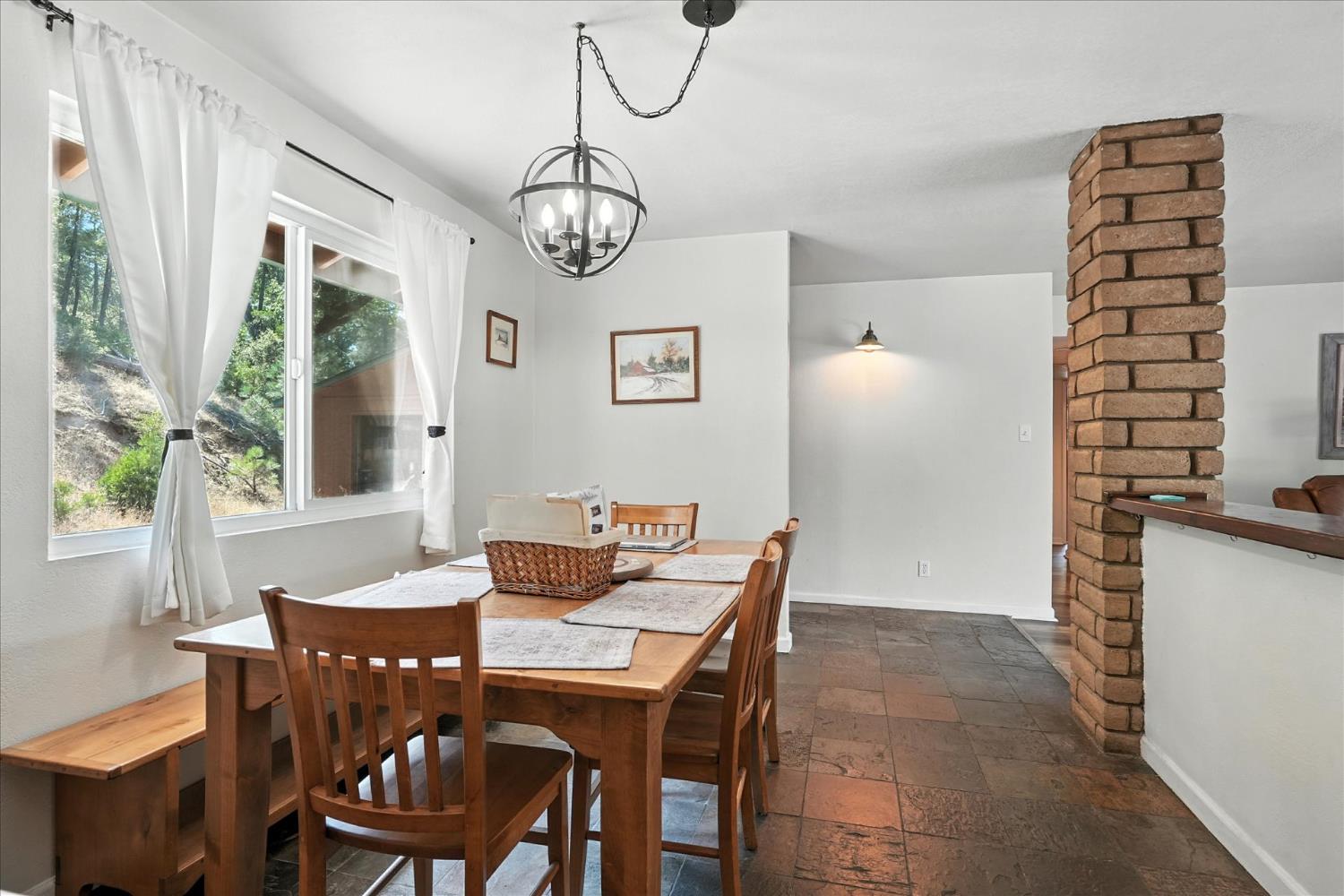39712 Deer Ridge Drive Oakhurst, CA 93644 - Photo 6 of 40 a view of a dining room with furniture window and wooden floor