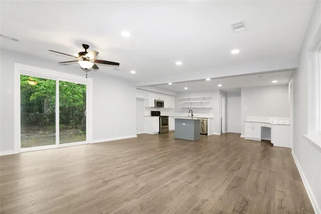 a view of a kitchen with a sink and a window