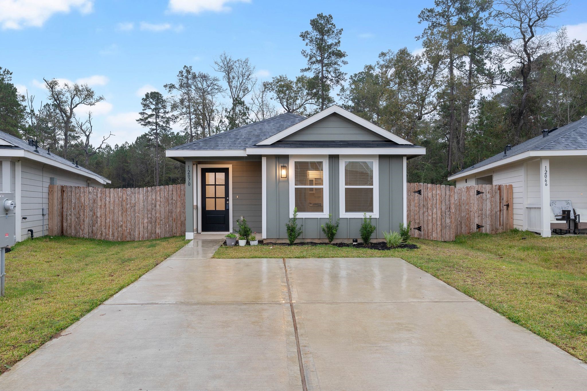 12070 William Trails Circle Willis, TX 77378 - Photo 1 of 18 a front view of a house with a yard and garage