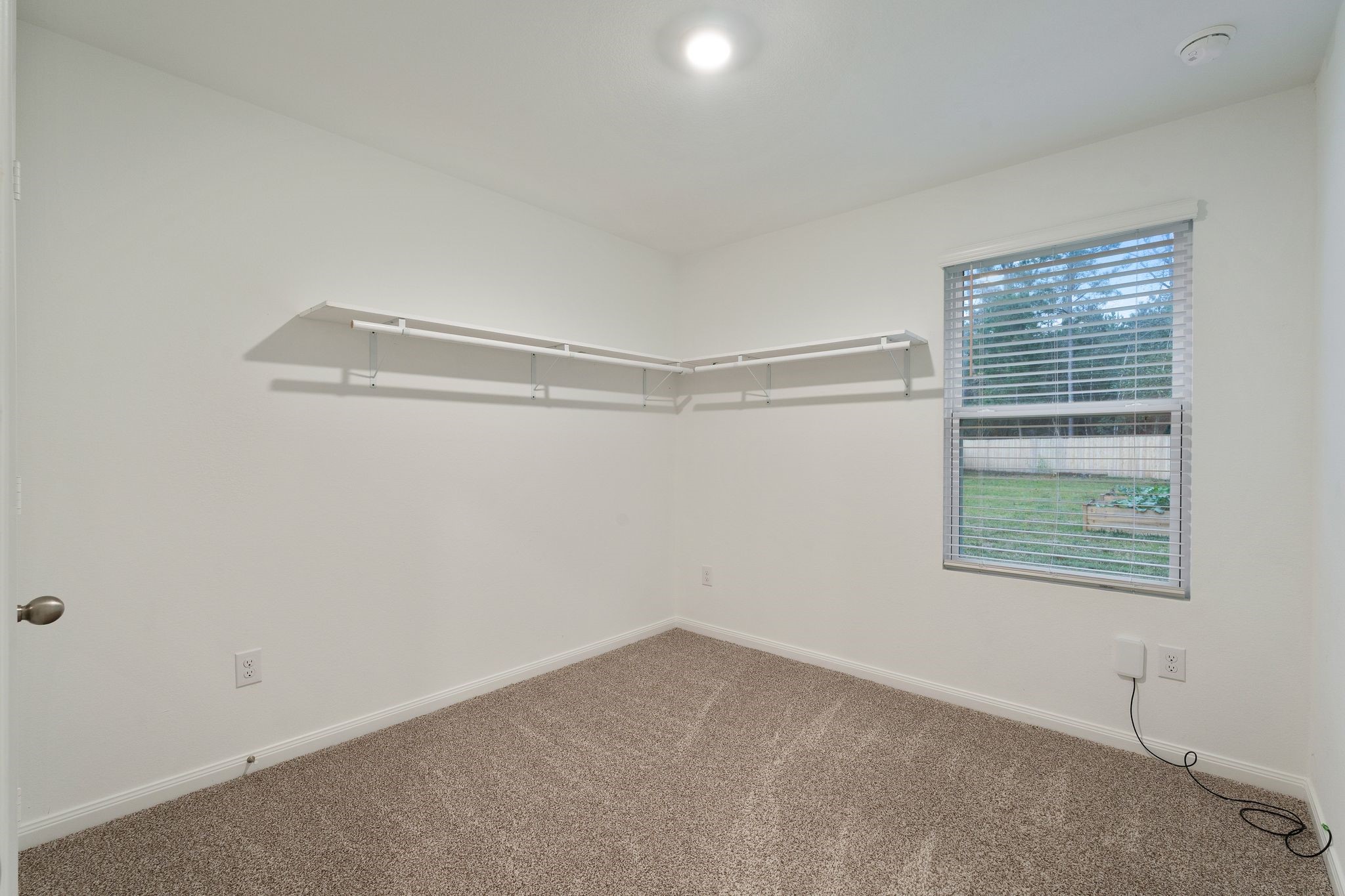 12070 William Trails Circle Willis, TX 77378 - Photo 14 of 18 a view of an empty room with a window