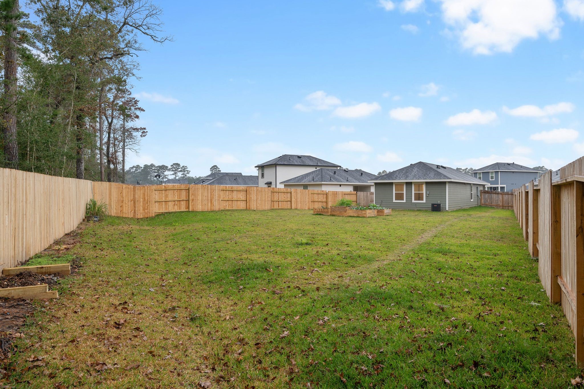 12070 William Trails Circle Willis, TX 77378 - Photo 15 of 18 a front view of a house with garden
