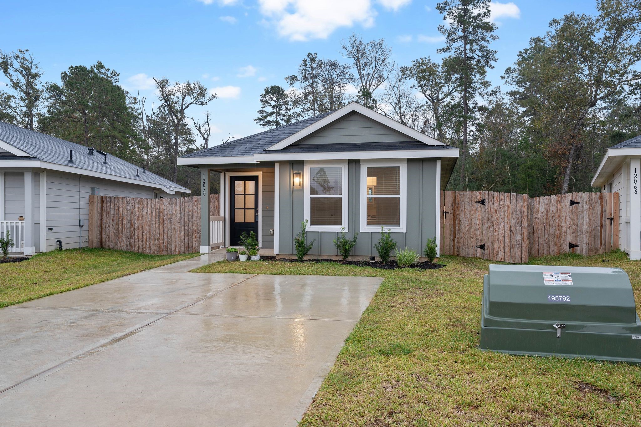 12070 William Trails Circle Willis, TX 77378 - Photo 17 of 18 a front view of a house with a yard and garage