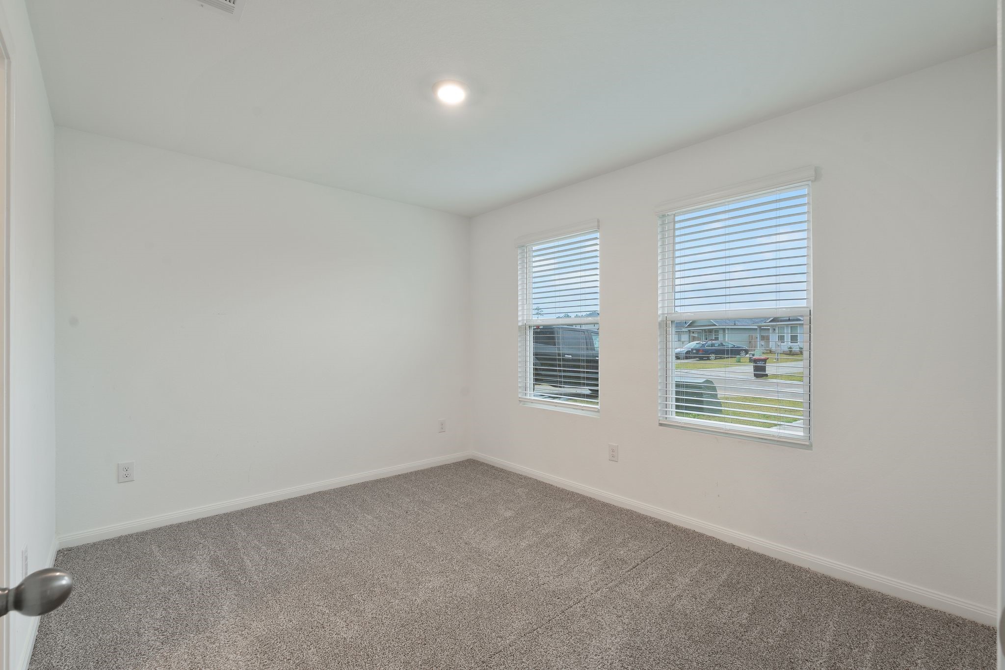 12070 William Trails Circle Willis, TX 77378 - Photo 7 of 18 an empty room with windows