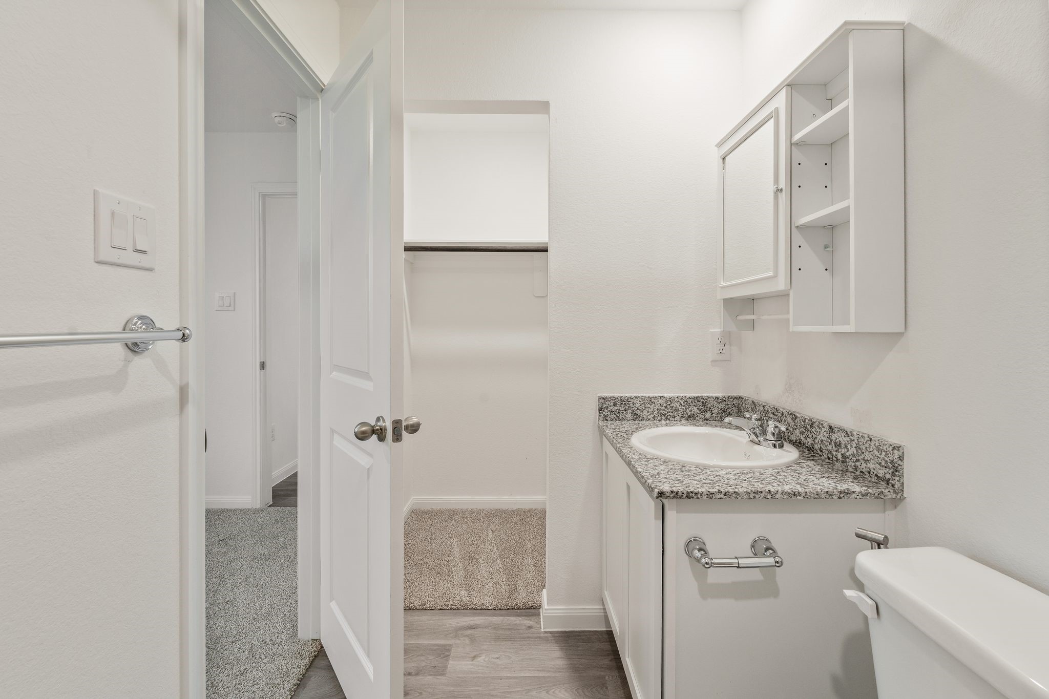 12070 William Trails Circle Willis, TX 77378 - Photo 10 of 18 a bathroom with a granite countertop sink and a mirror