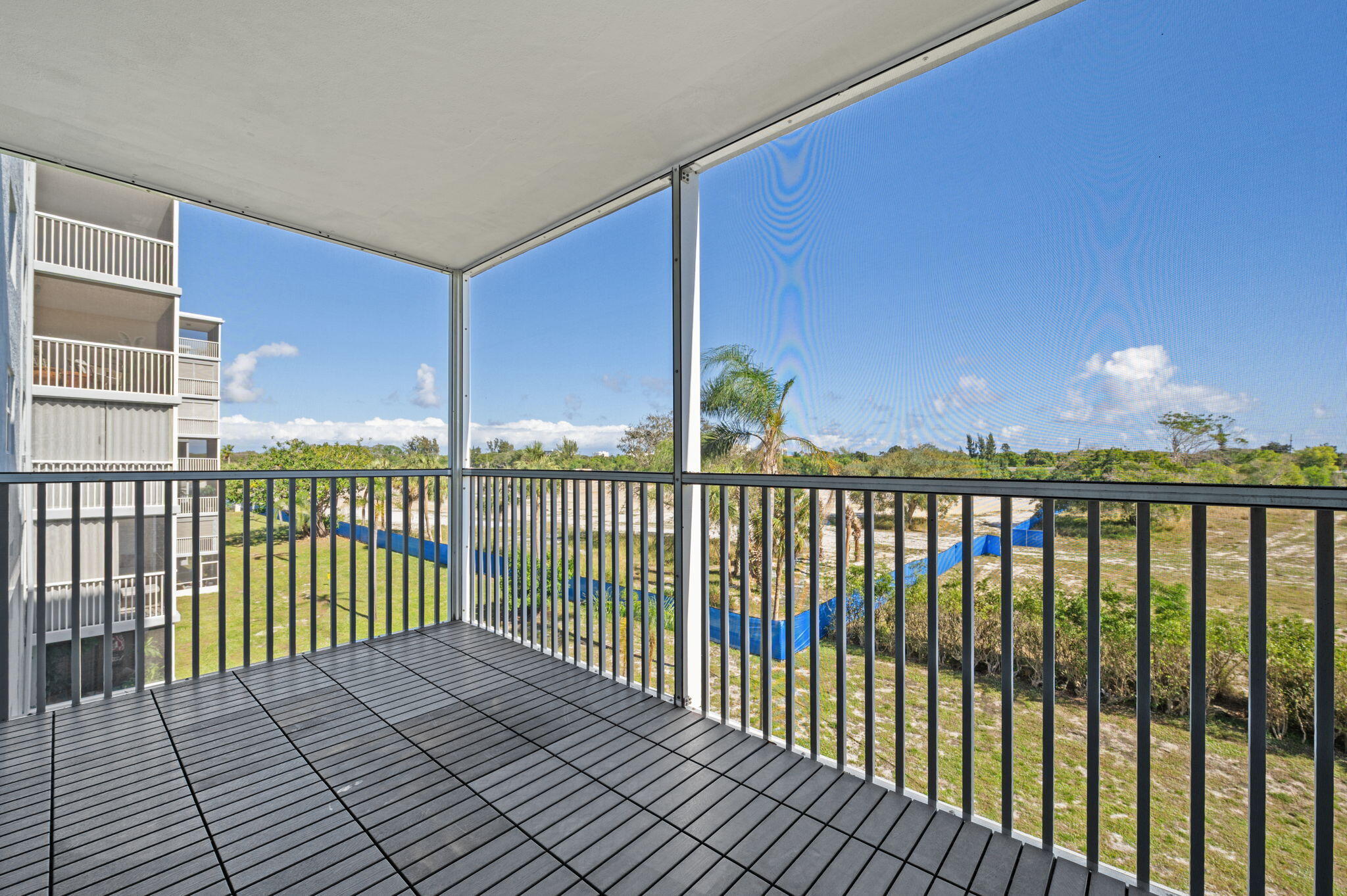 a view of balcony with wooden floor