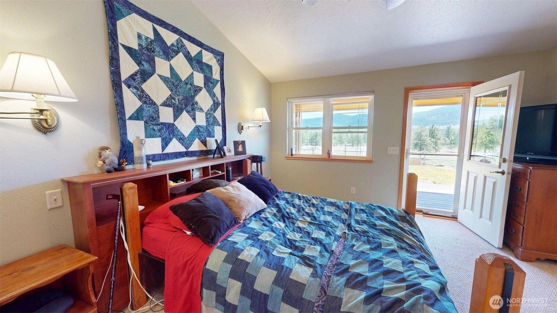 37 No. Name Road Tonasket, WA 98855 - Photo 10 of 33 a bedroom with a bed and wooden floor