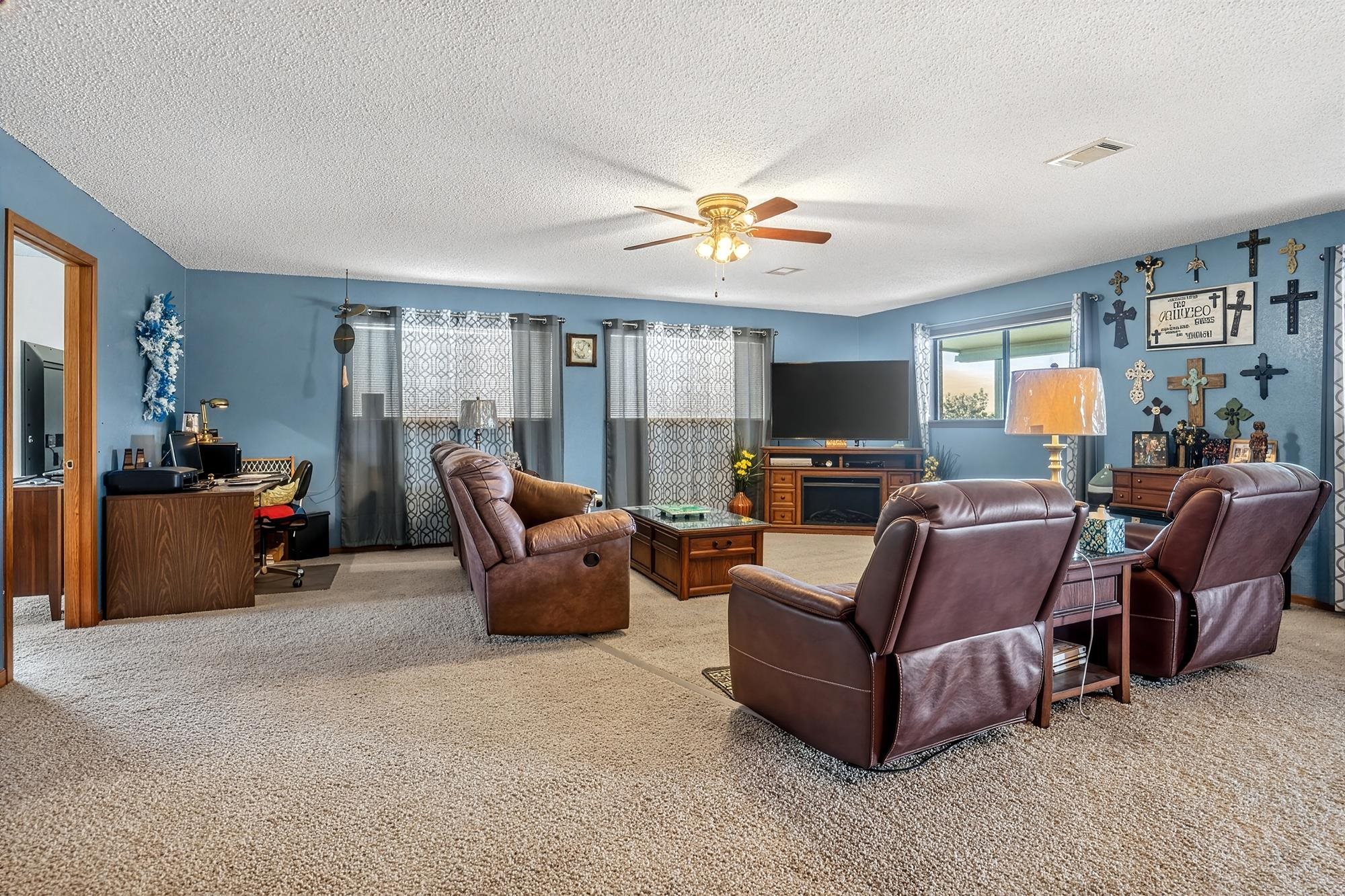 10465 Ranch To Market 1431 Buchanan Dam, TX 78609 - Photo 19 of 29 a living room with furniture and a flat screen tv