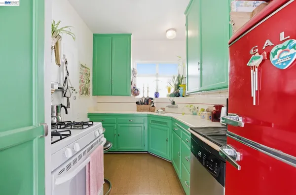 a kitchen with a sink stove and cabinets